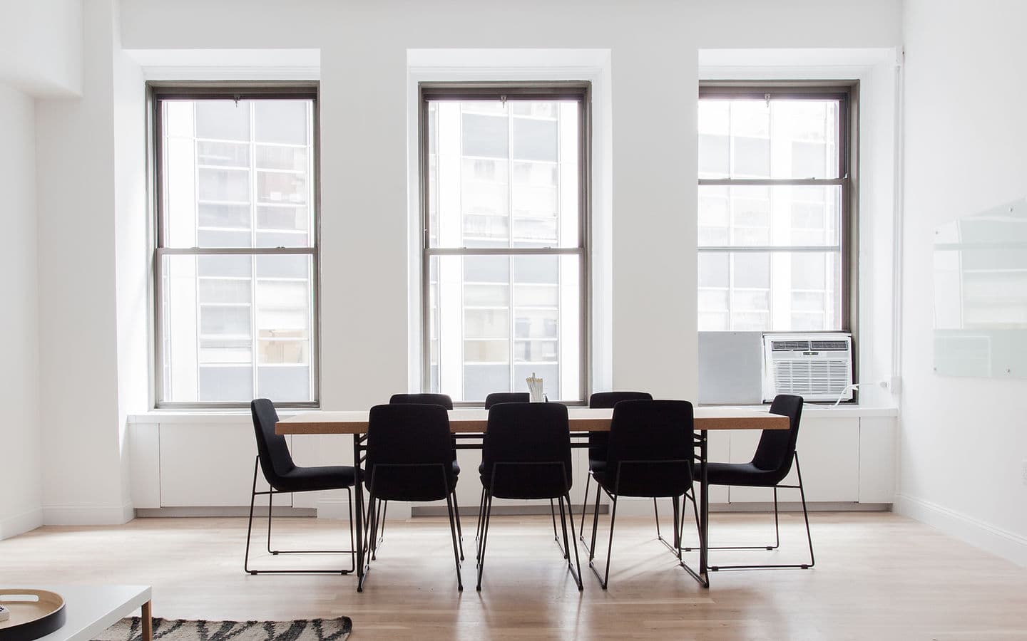 Bright office interior with tall, spotlessly clean windows